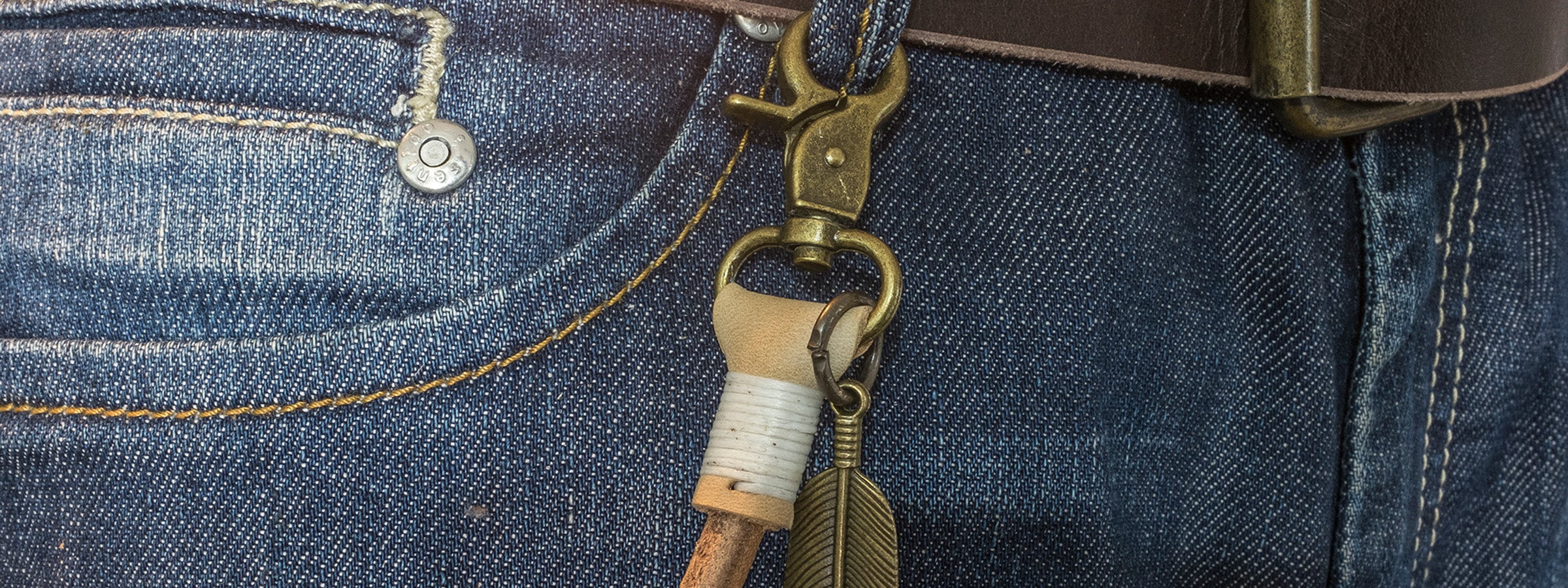 Natural leather keychain attached to belt loop