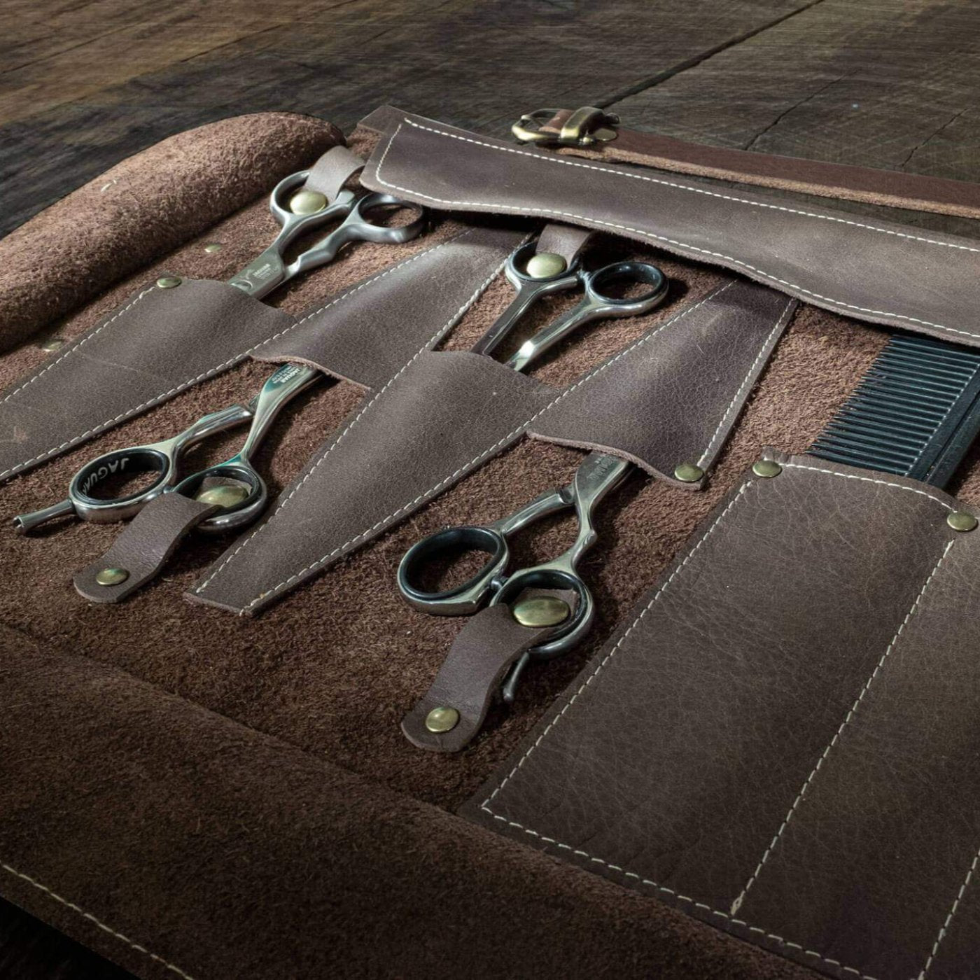 close up scissor pocket Duke and Sons Professional barber tool roll in brown leather