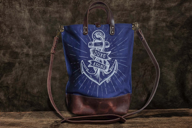 handmade blue canvas tote bag with white anchor image front scene