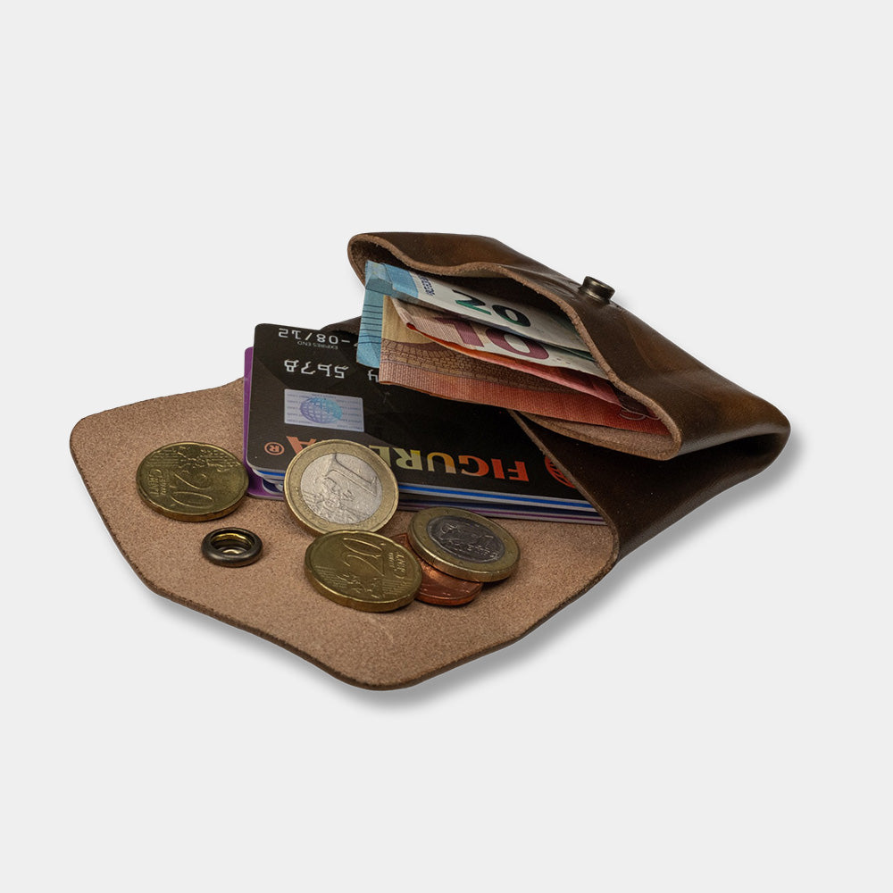 Pocket wallet open with money and cards slanted view