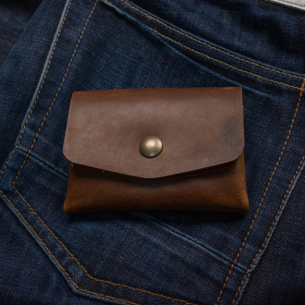 Pocket wallet, (distressed leather) - front on denim