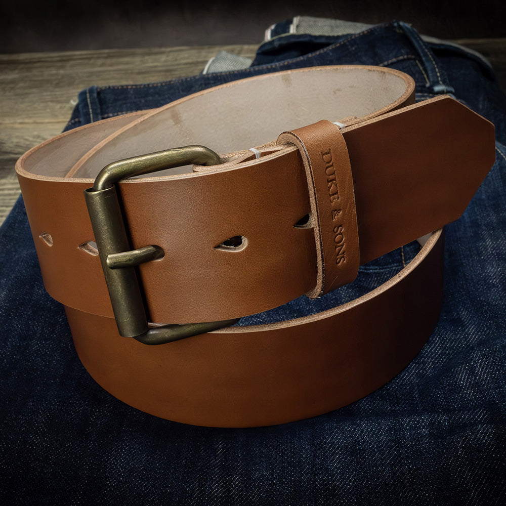 Duke and Sons 2-inch cognac leather jeans belt with old bronze buckle on jeans hero image