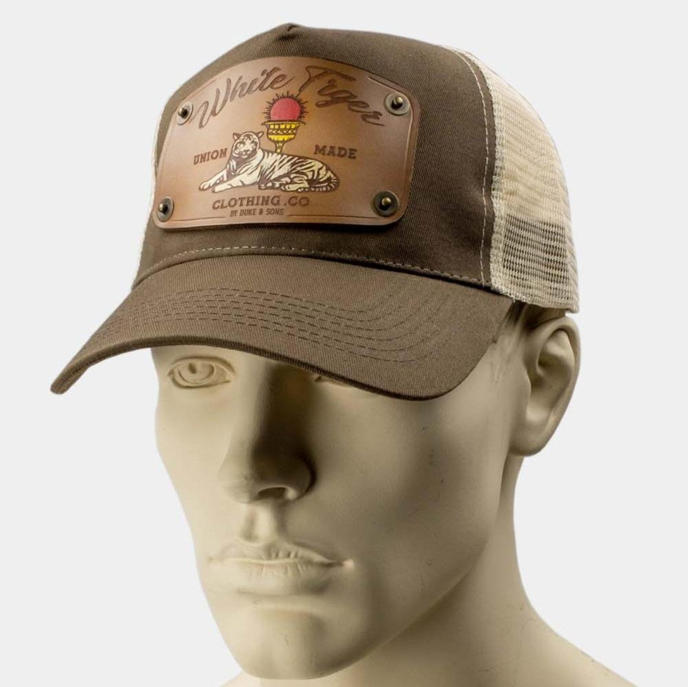 wearing brown trucker cap with handmade leather patch white tiger front | Duke and Sons Leather