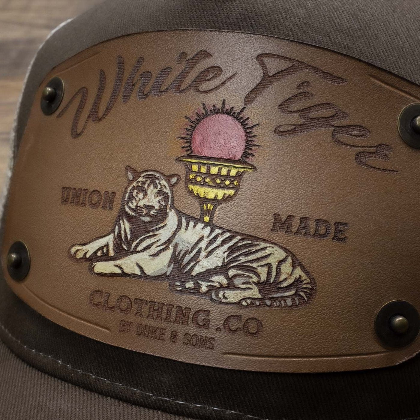 detail brown trucker cap with handmade leather patch white tiger | Duke and Sons Leather