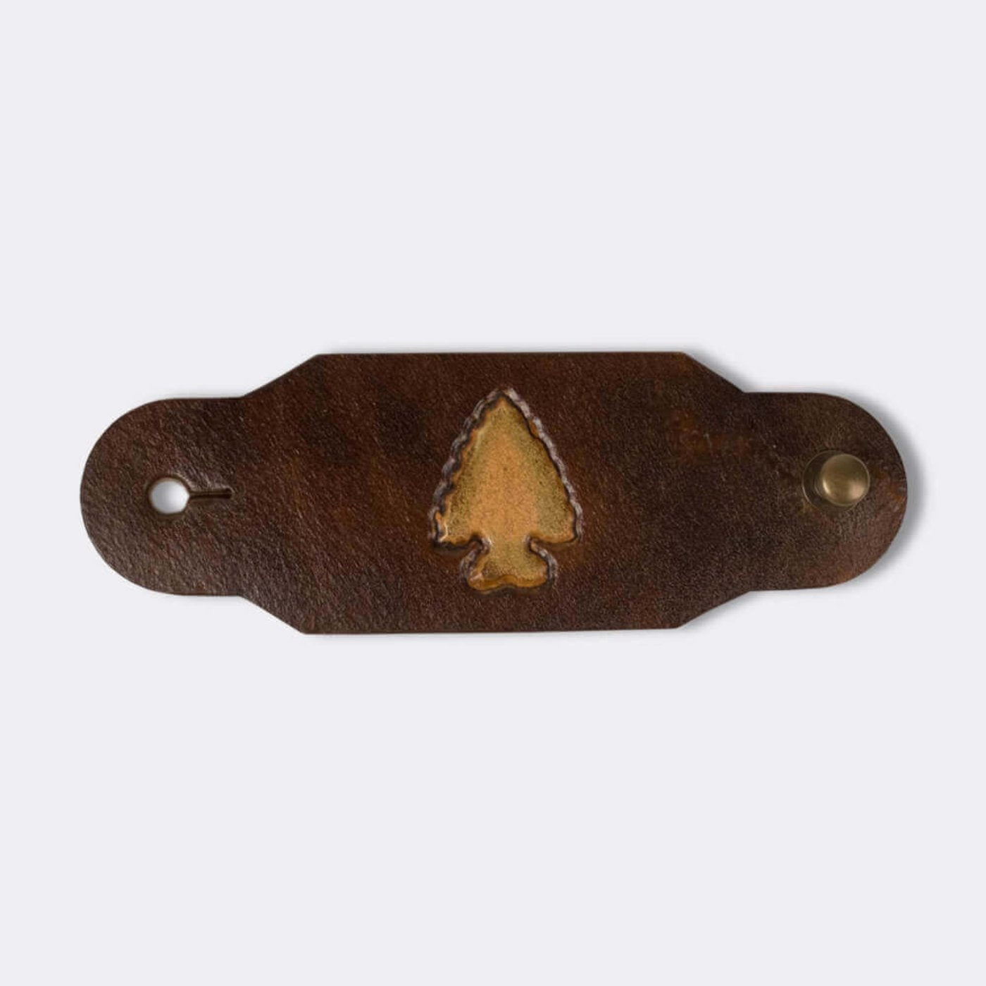 Woggle, bandana / neckerchief slide made from leather with an arrow point image stamp
