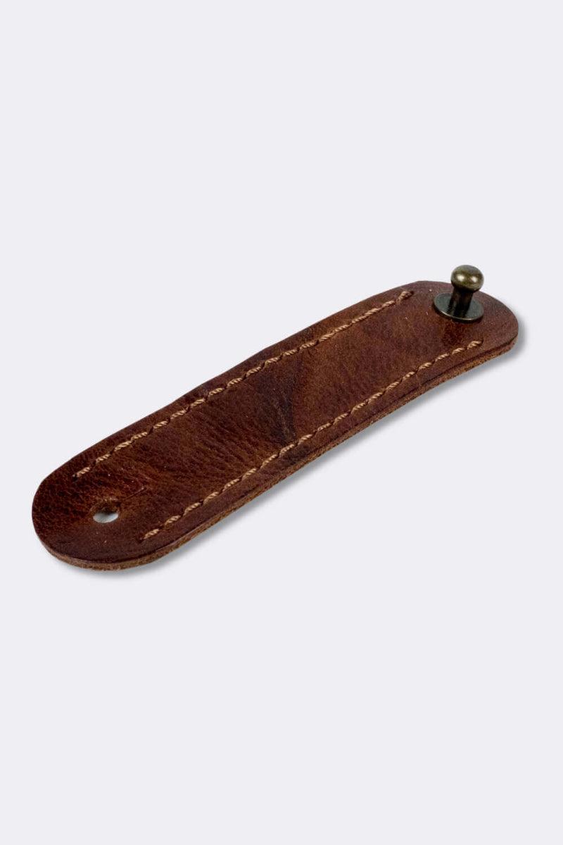 Woggle, bandana / neckerchief slide - in dark brown leather. Duke & Sons Leather, slanted view