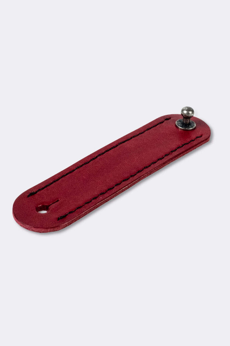 Woggle, bandana / neckerchief slide - in red leather. Duke & Sons Leather, slanted view