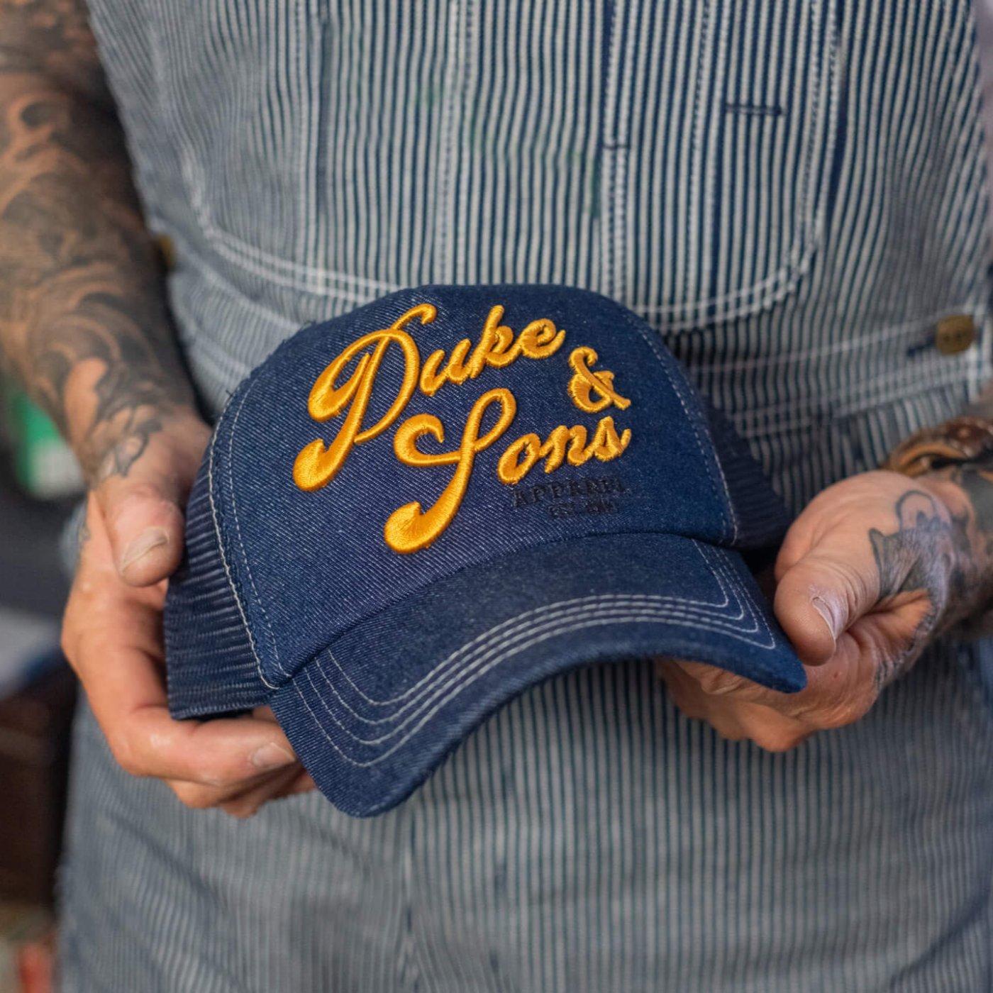 Duke and sons denim trucker cap scene hands