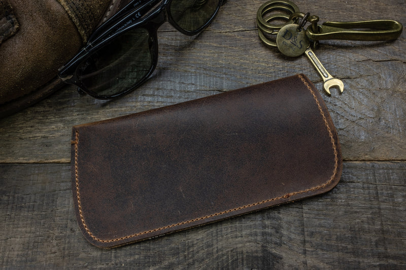 Distressed brown leather sunglass pouch glasses scene 1