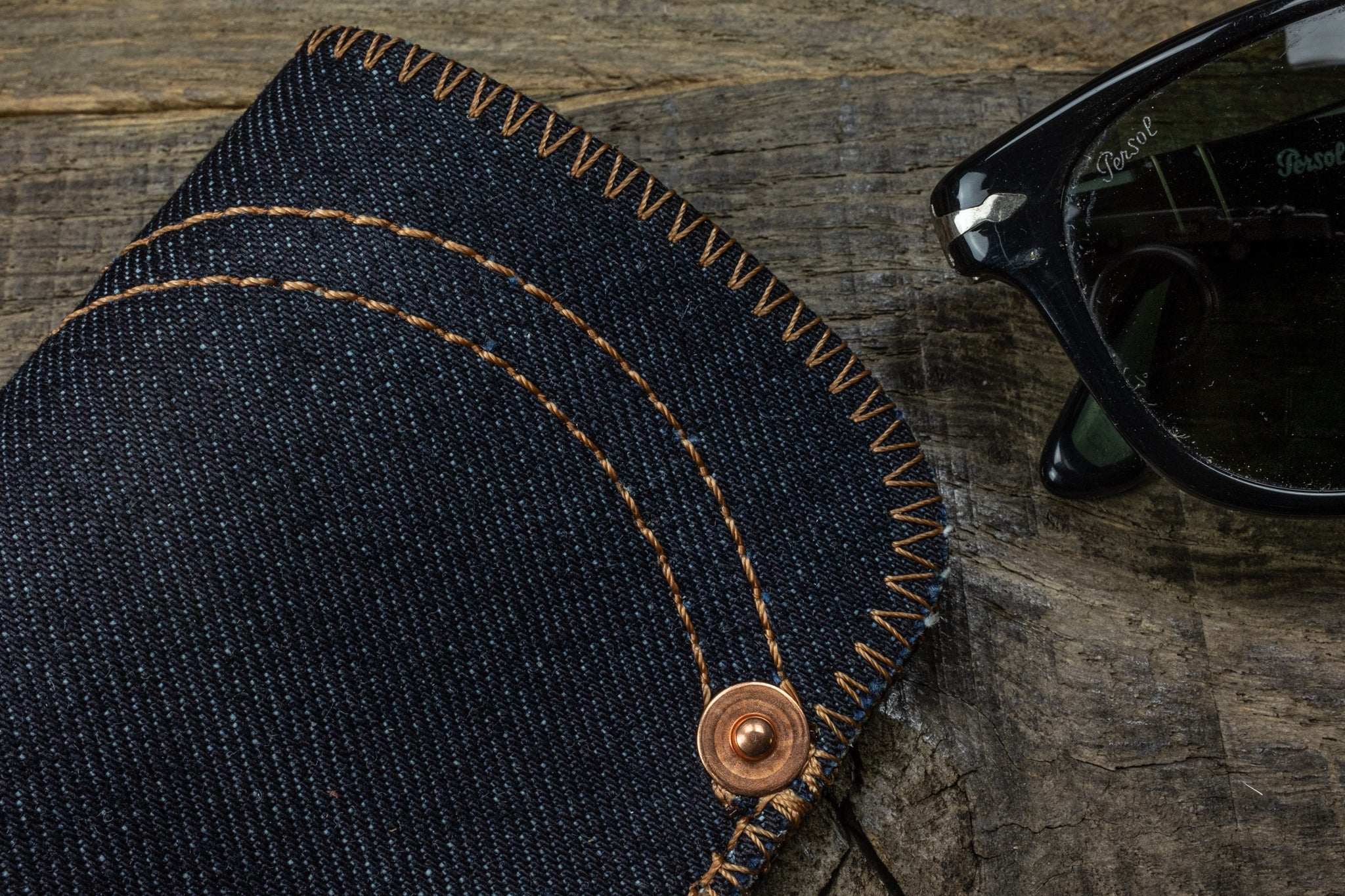 Selvedge denim sunglass pouch orange wing detail scene