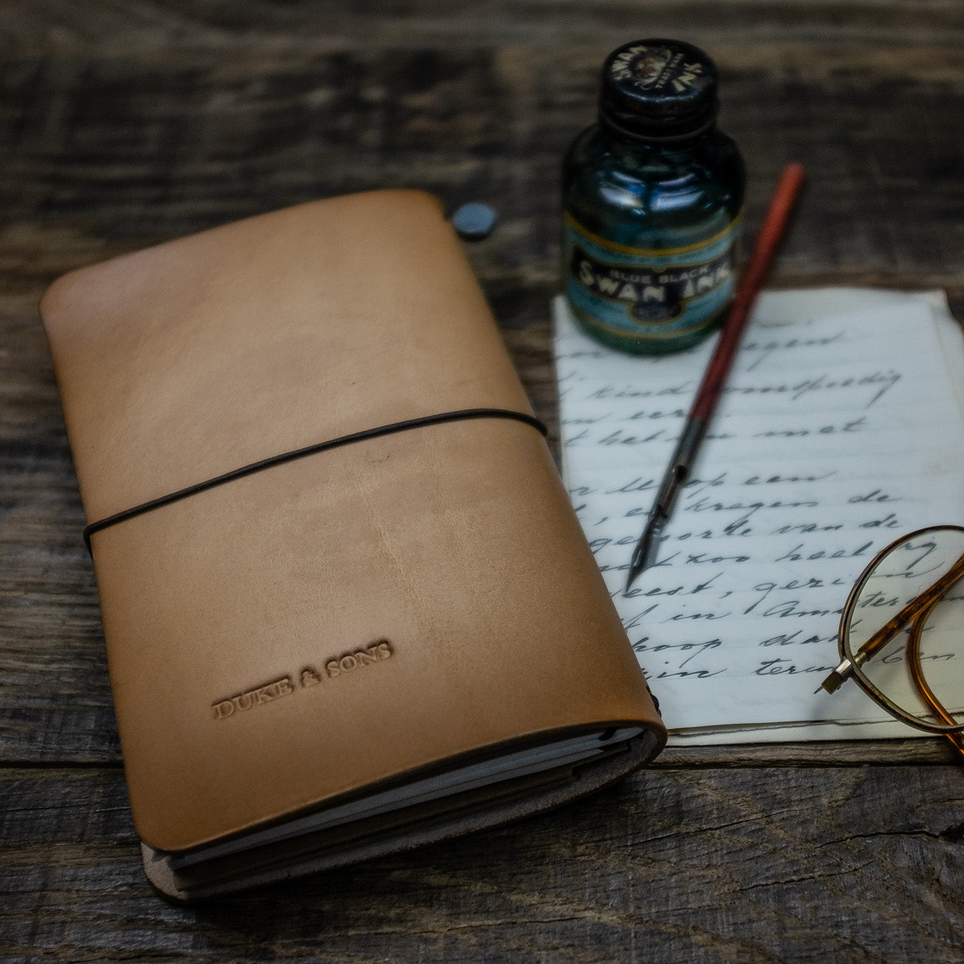 Duke and Sons vegetan leather Traveler notebook with custom logo scene back