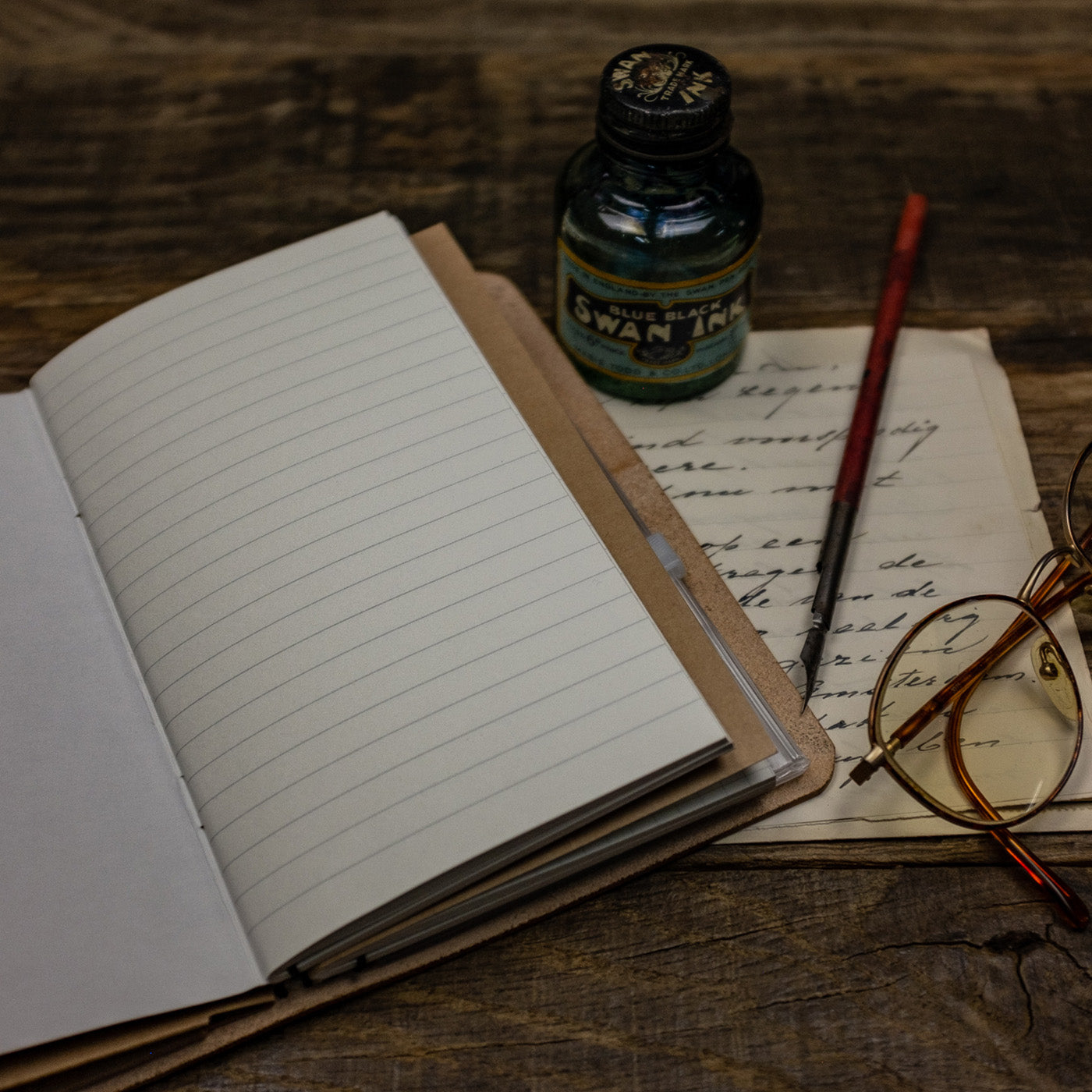 Duke and Sons vegetan leather Traveler notebook with custom logo scene open