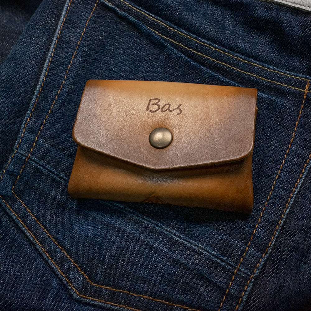 Pocket wallet Owl, closed on denim, front - name view