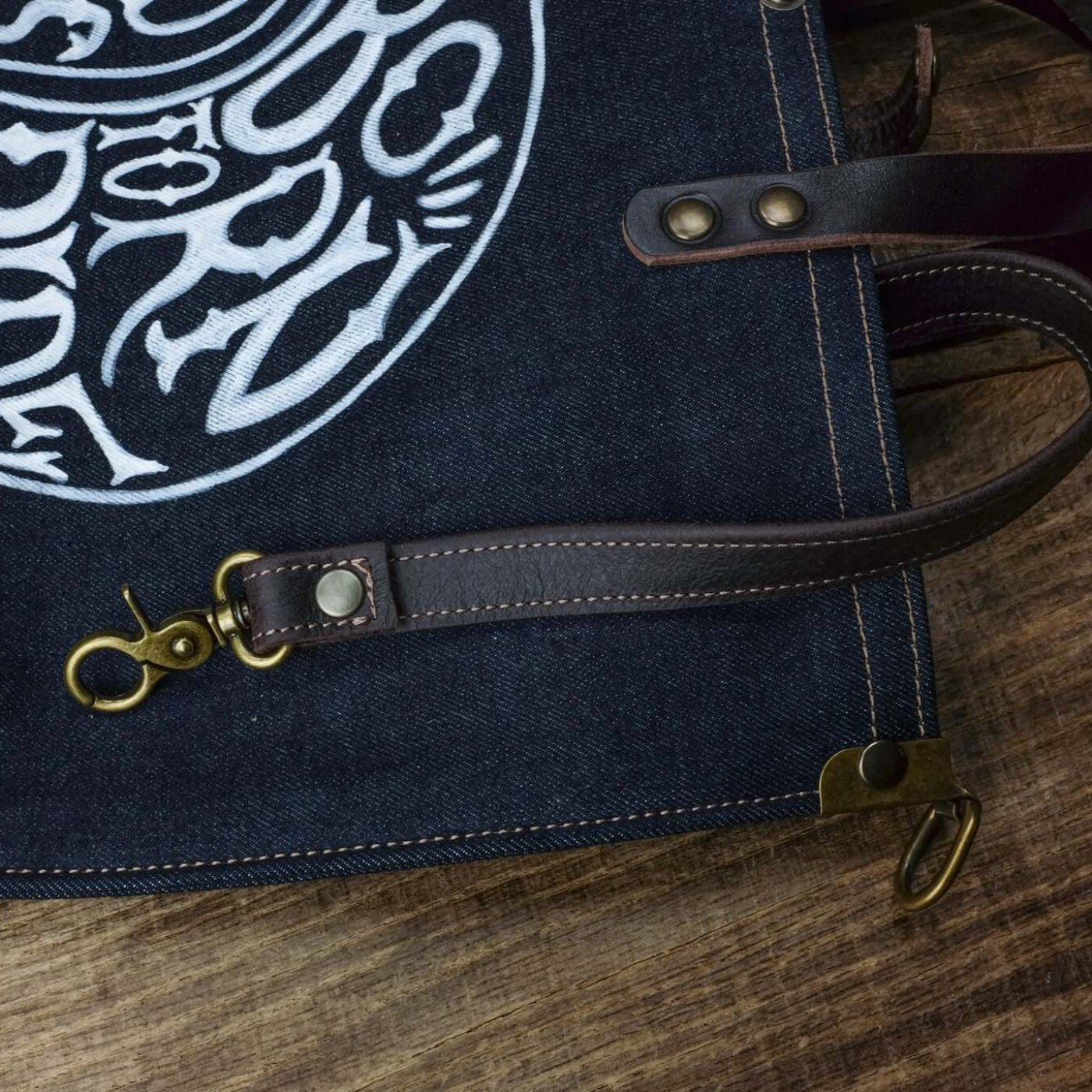 detail inside keychain, selvedge denim tote bag, hand drawn logo born to ride scene front