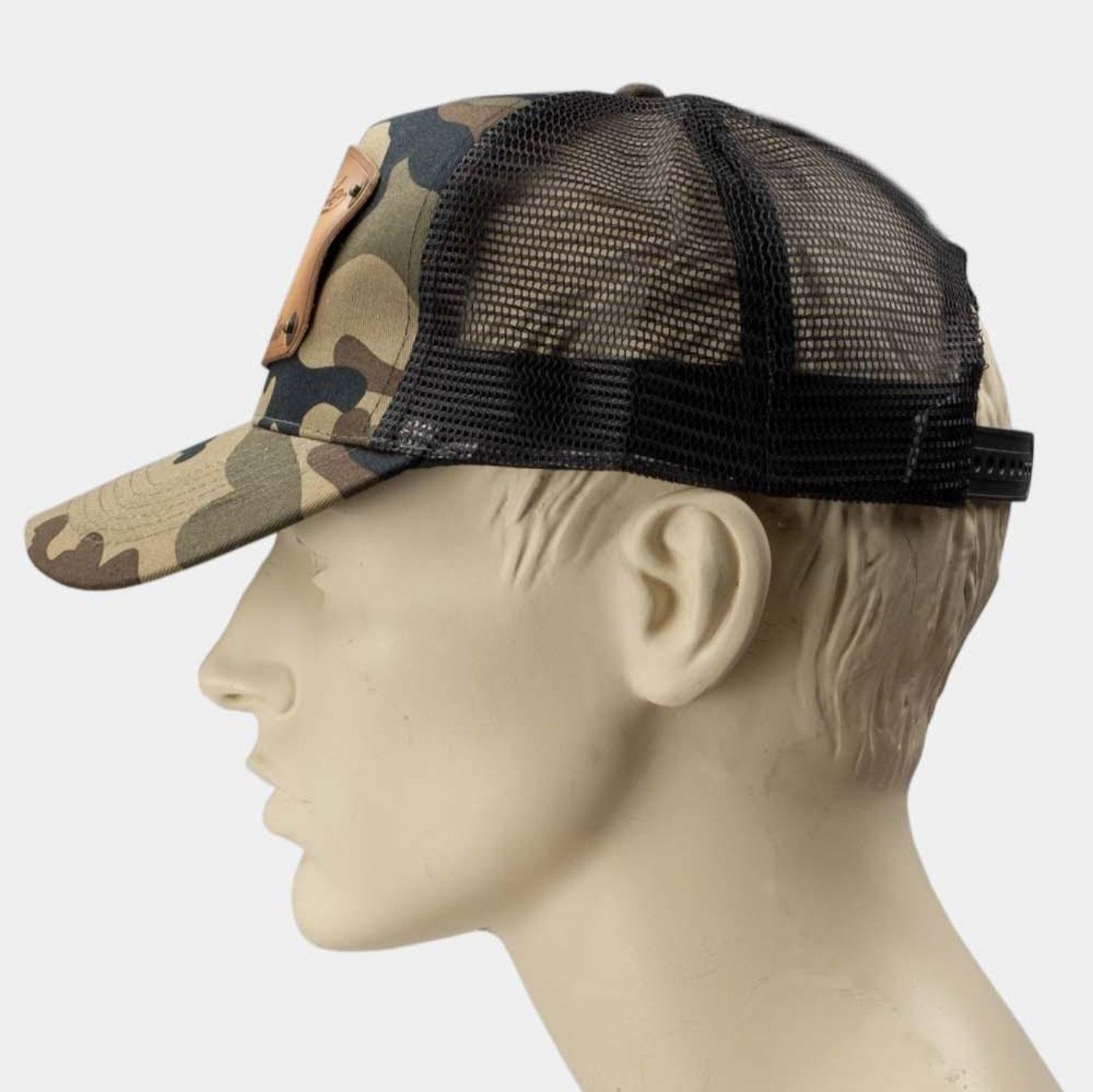 wearing Camo trucker cap with handmade leather patch apparel side | Duke and Sons Leather