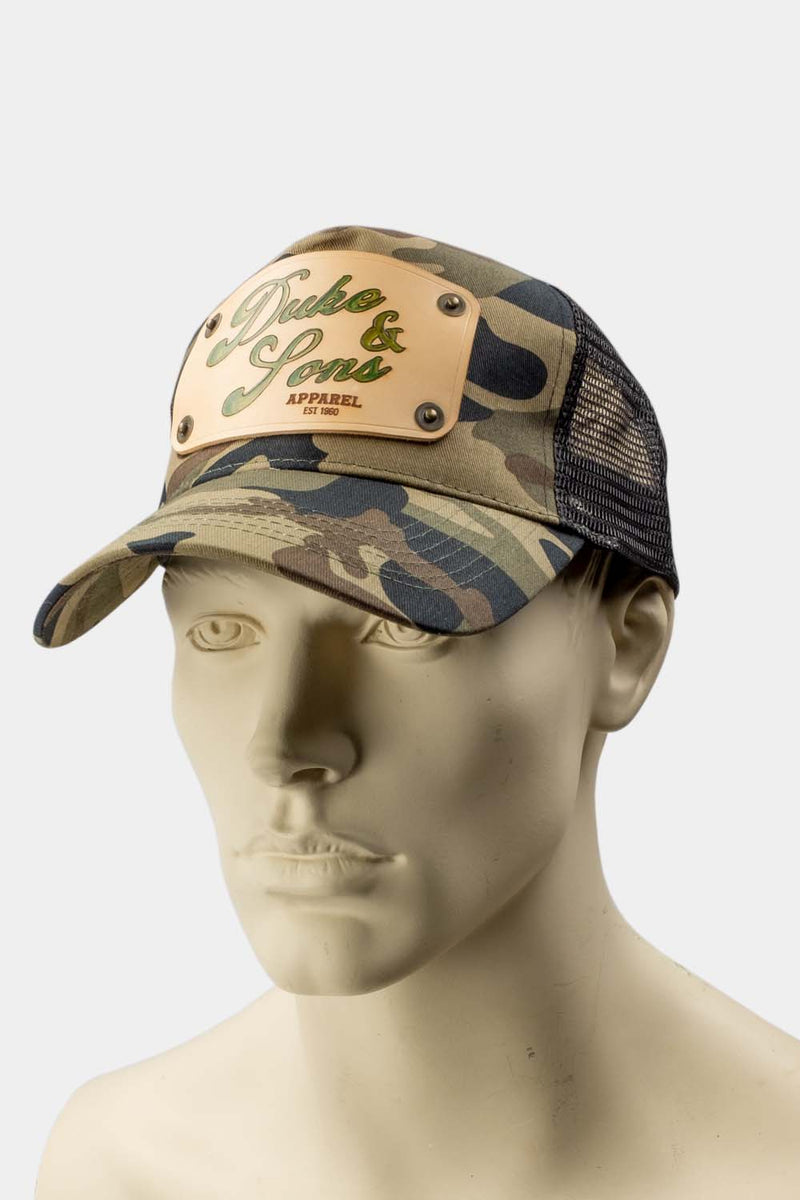 wearing Camo trucker cap with handmade leather patch apparel front | Duke and Sons Leather