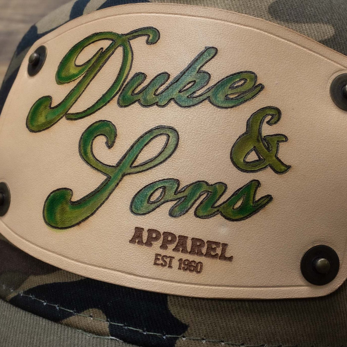 detail Camo trucker cap with handmade leather patch apparel | Duke and Sons Leather