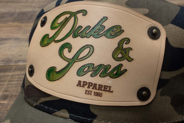 detail Camo trucker cap with handmade leather patch apparel | Duke and Sons Leather