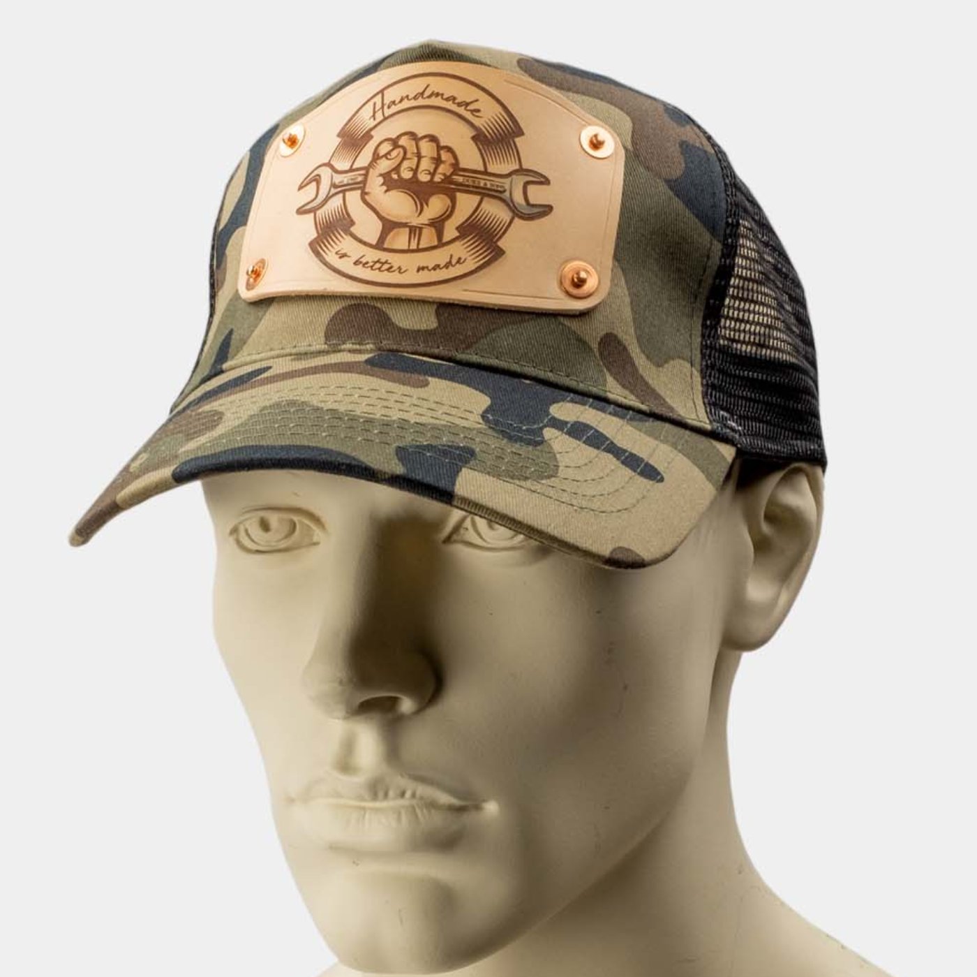 wearing Camo trucker cap with handmade leather patch front spanner | Duke and Sons Leather