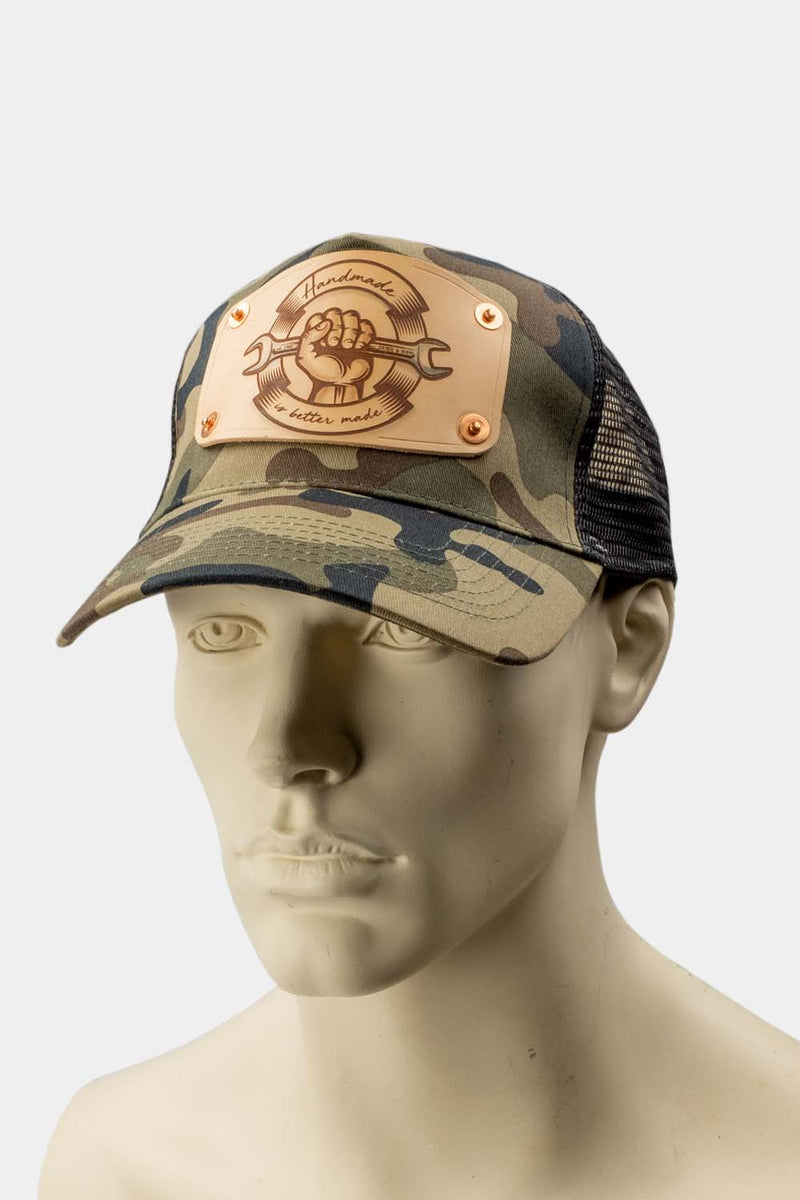 wearing Camo trucker cap with handmade leather patch front spanner | Duke and Sons Leather