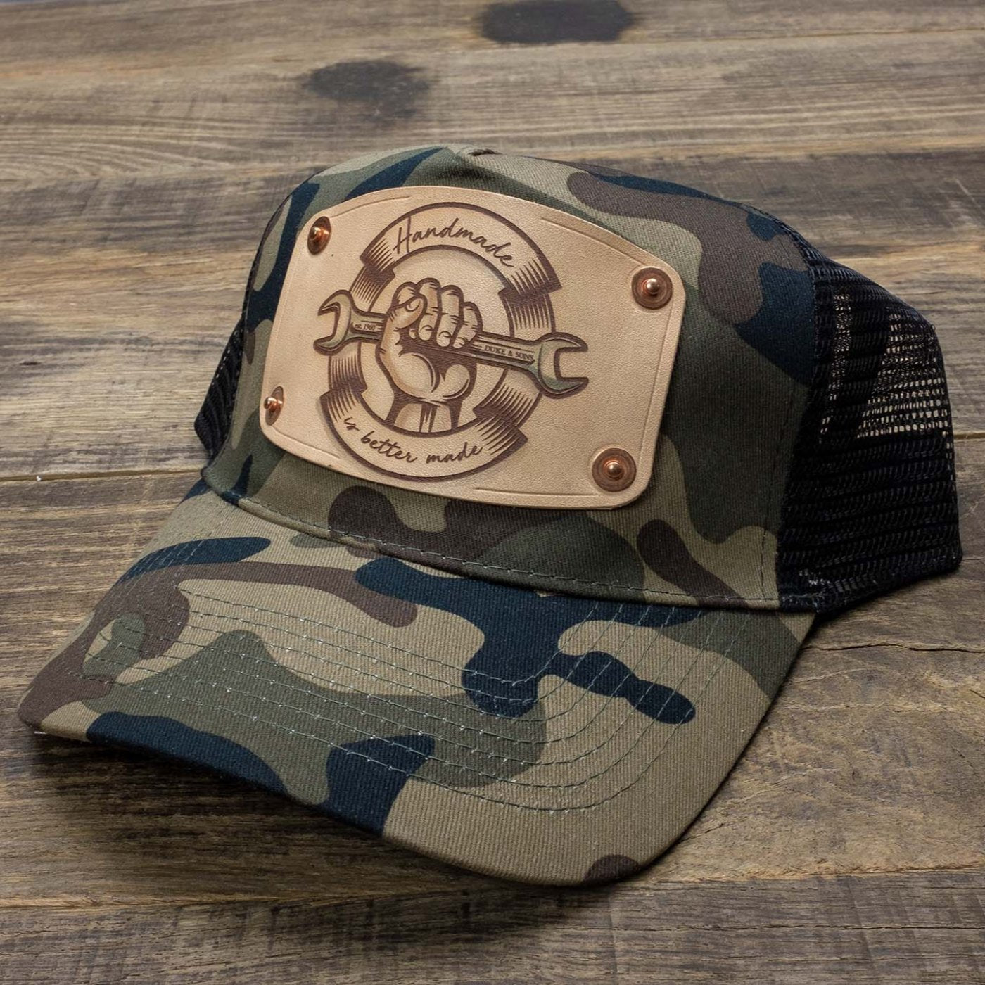 Camo trucker cap with handmade leather patch spanner | Duke and Sons Leather