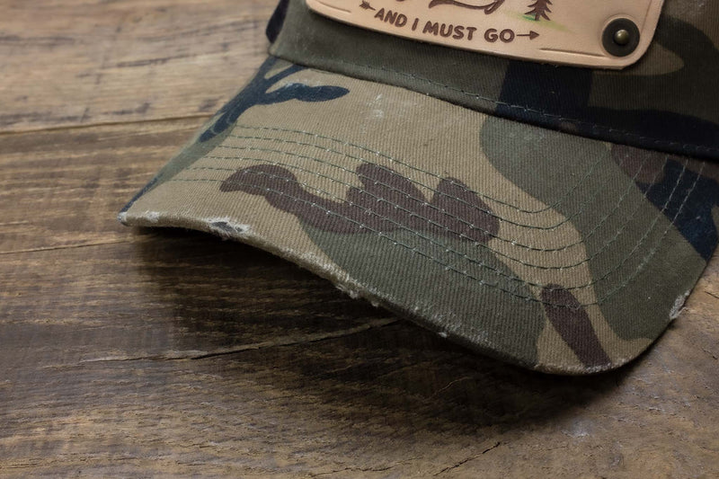 vintage detail 1 Camo trucker cap with handmade leather patch mountain | Duke and Sons Leather