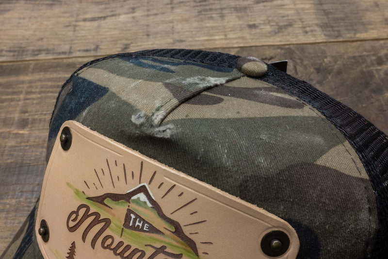 vintage detail 2 Camo trucker cap with handmade leather patch mountain | Duke and Sons Leather