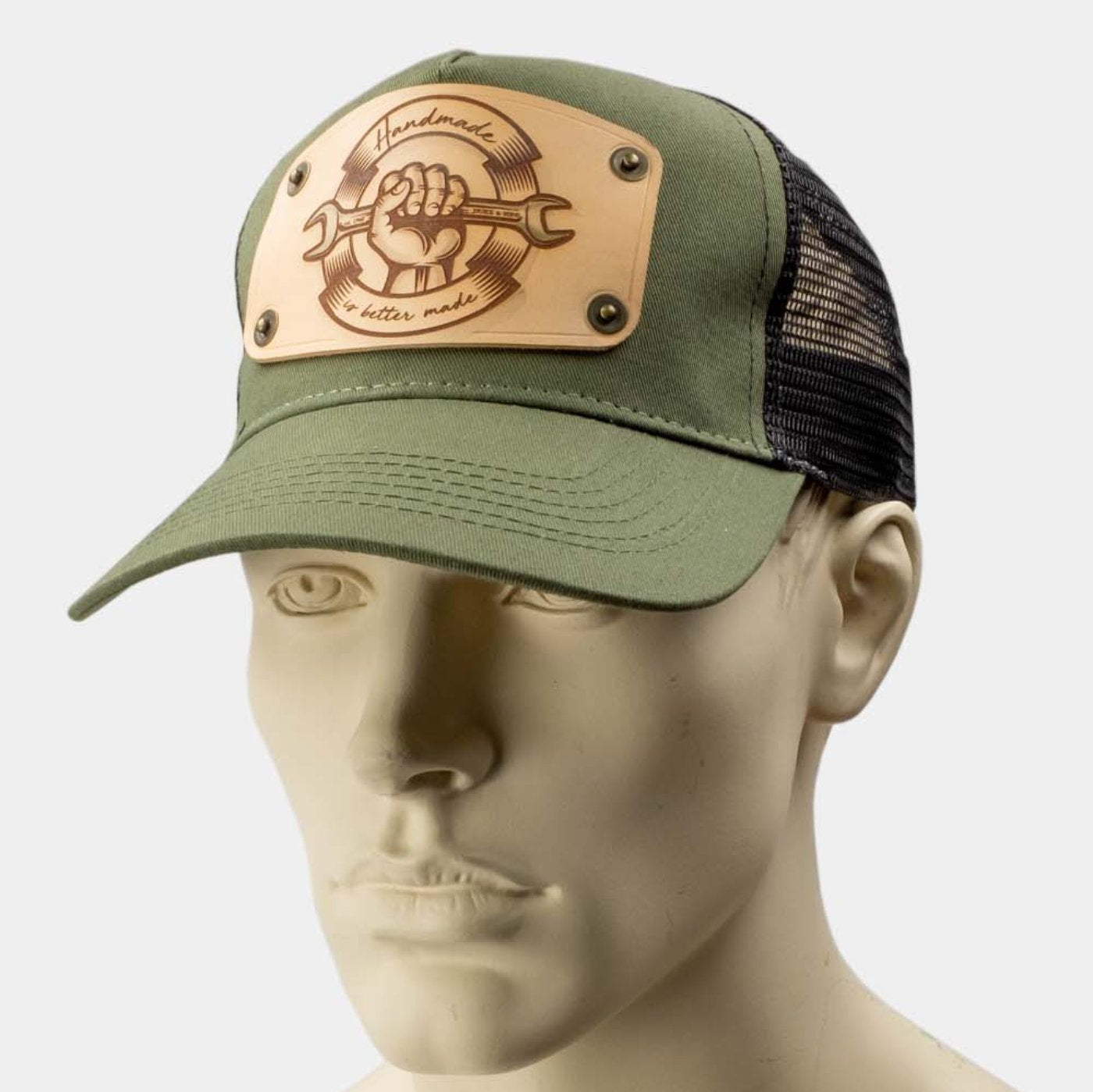 wearing green trucker cap with handmade leather patch spanner front | Duke and Sons Leather