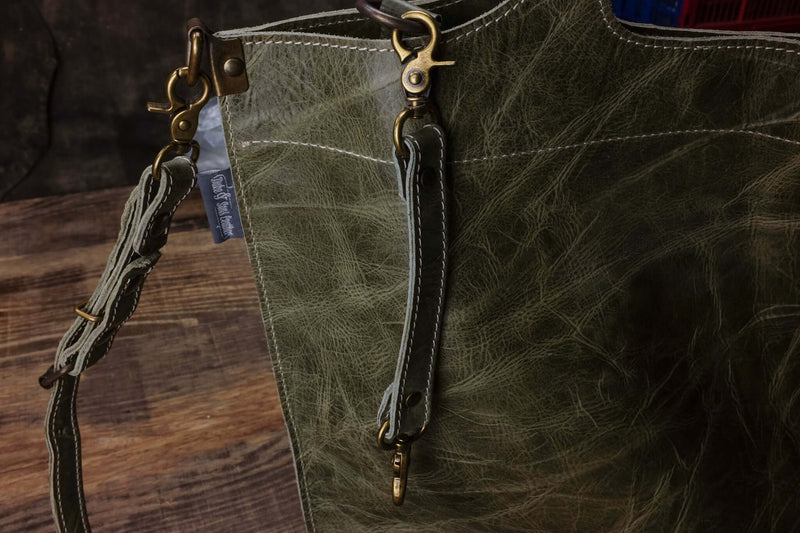 Handmade green leather tote bag inside keychain detail