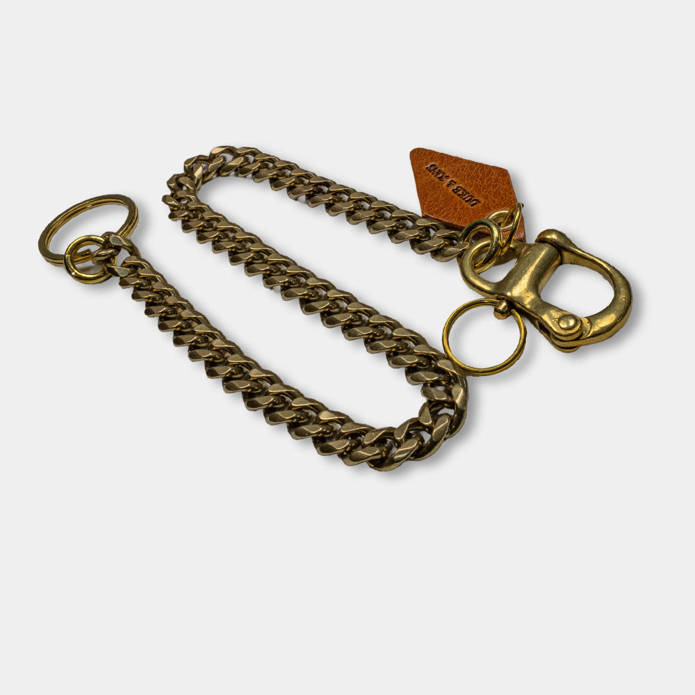 solid brass keychain with Swedish nautical shackle and cognac leather diamond charm top view
