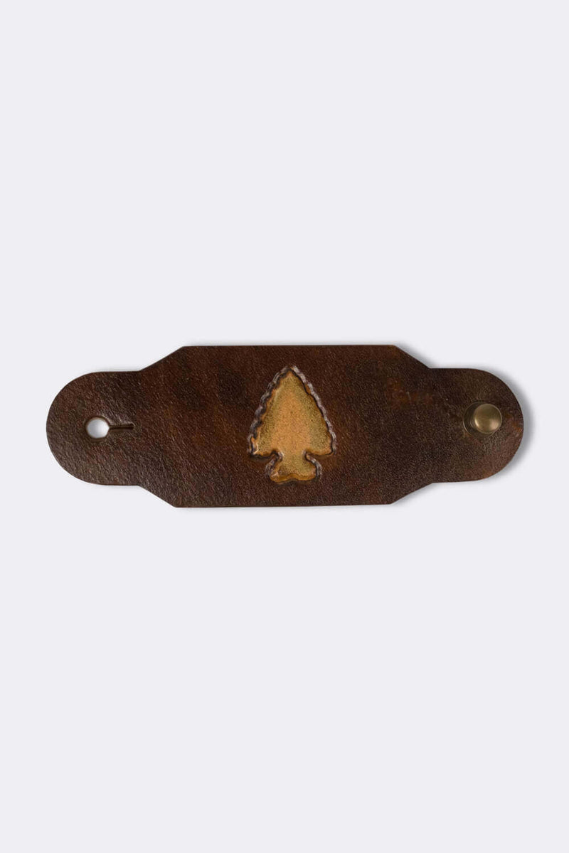 Woggle, bandana / neckerchief slide made from leather with an arrow point image stamp
