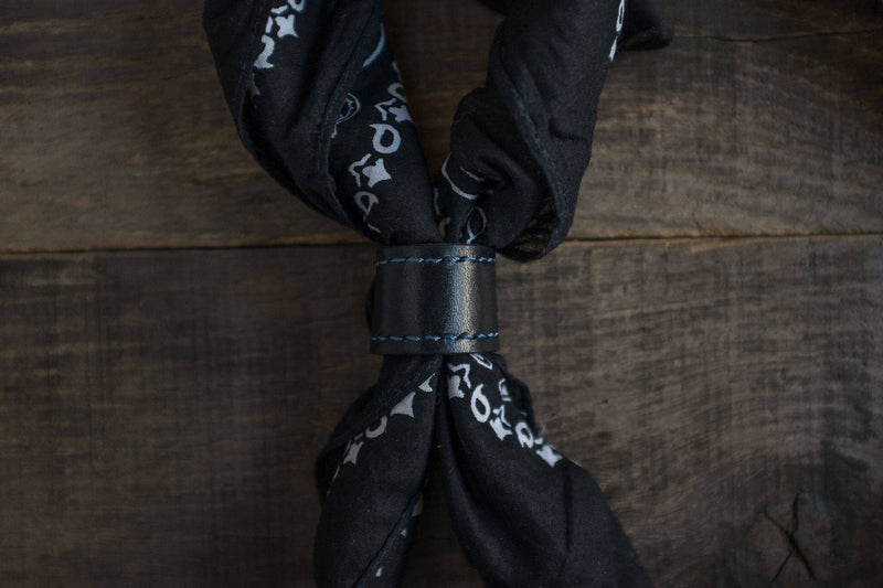 Woggle, bandana / neckerchief slide - in black leather. Duke & Sons Leather, wearing around a black bandana