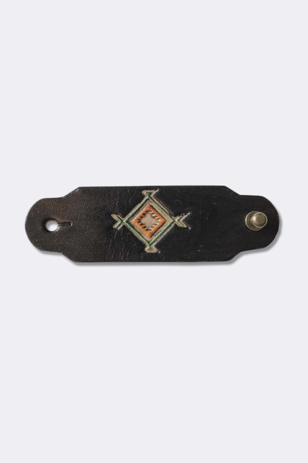Woggle, bandana / neckerchief slide in black leather with a square native pattern stamp