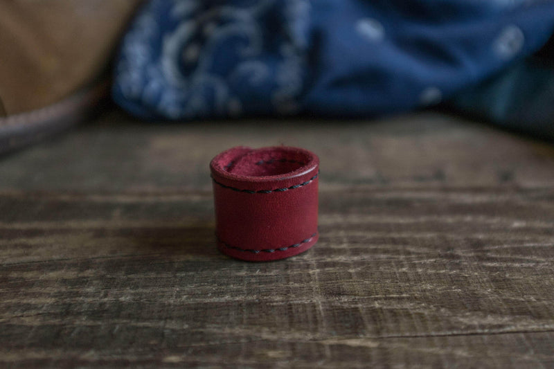 Woggle, bandana / neckerchief slide - in red leather. Duke & Sons Leather, close-up view