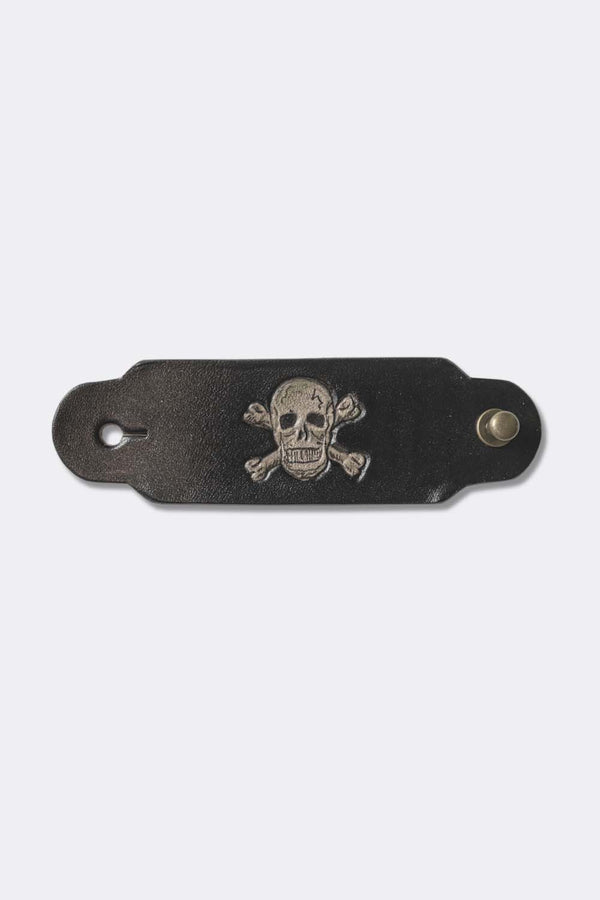 Woggle, bandana / neckerchief slide in black leather with a skull image stamp