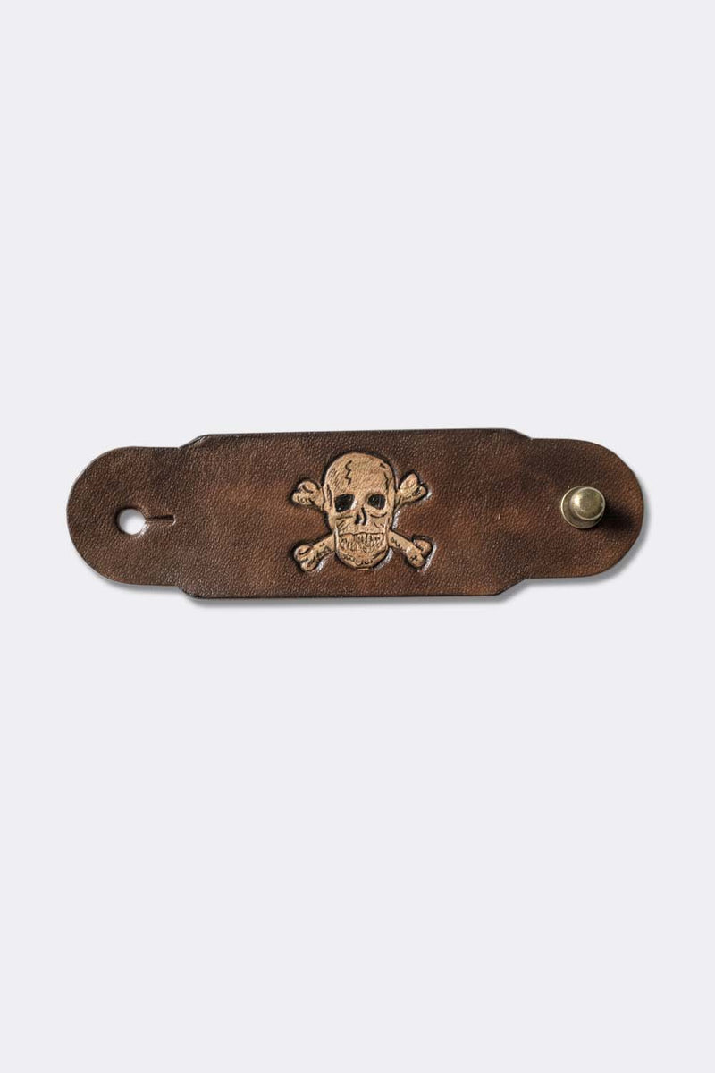 Woggle, bandana / neckerchief slide in brown leather with a skull image stamp