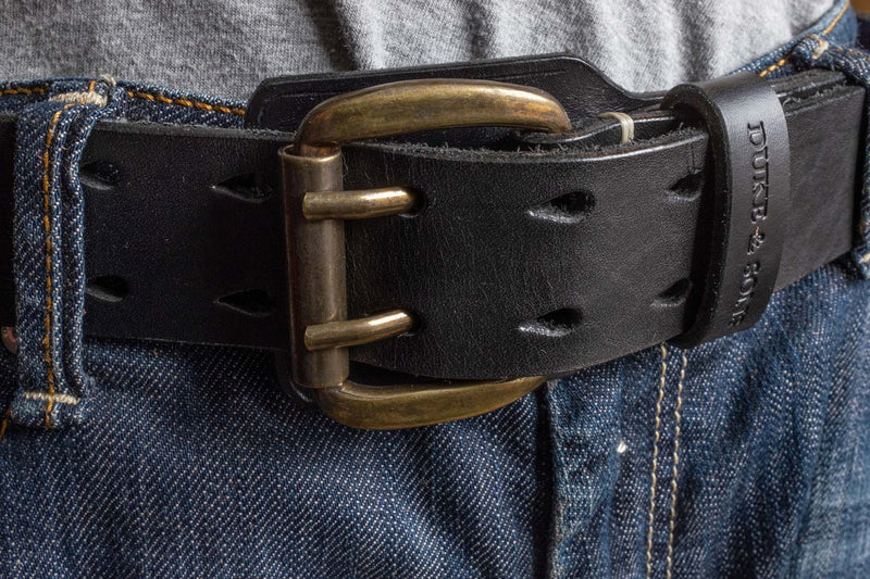 Heavy Duty leather belt in black with extra belt loop, wearing on a jeans. Duke & Sons Leather, front view