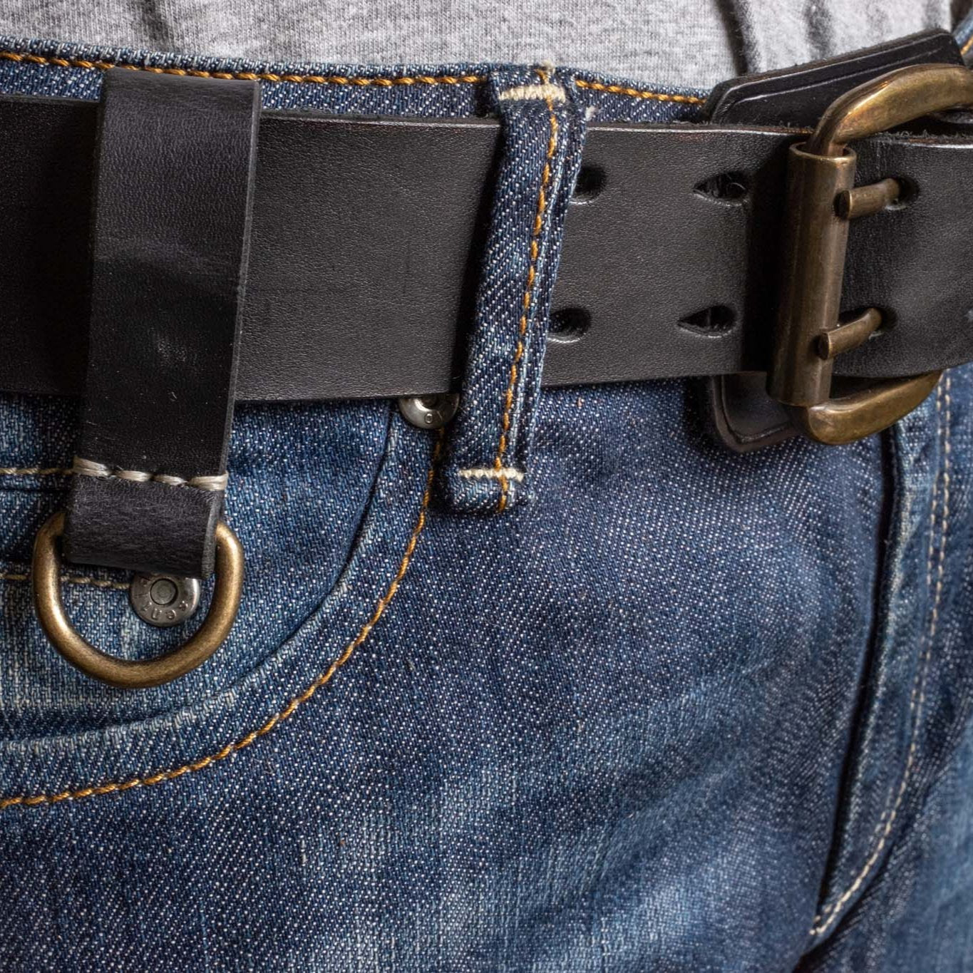 Heavy Duty leather belt in black with extra belt loop, wearing on a jeans. Duke & Sons Leather