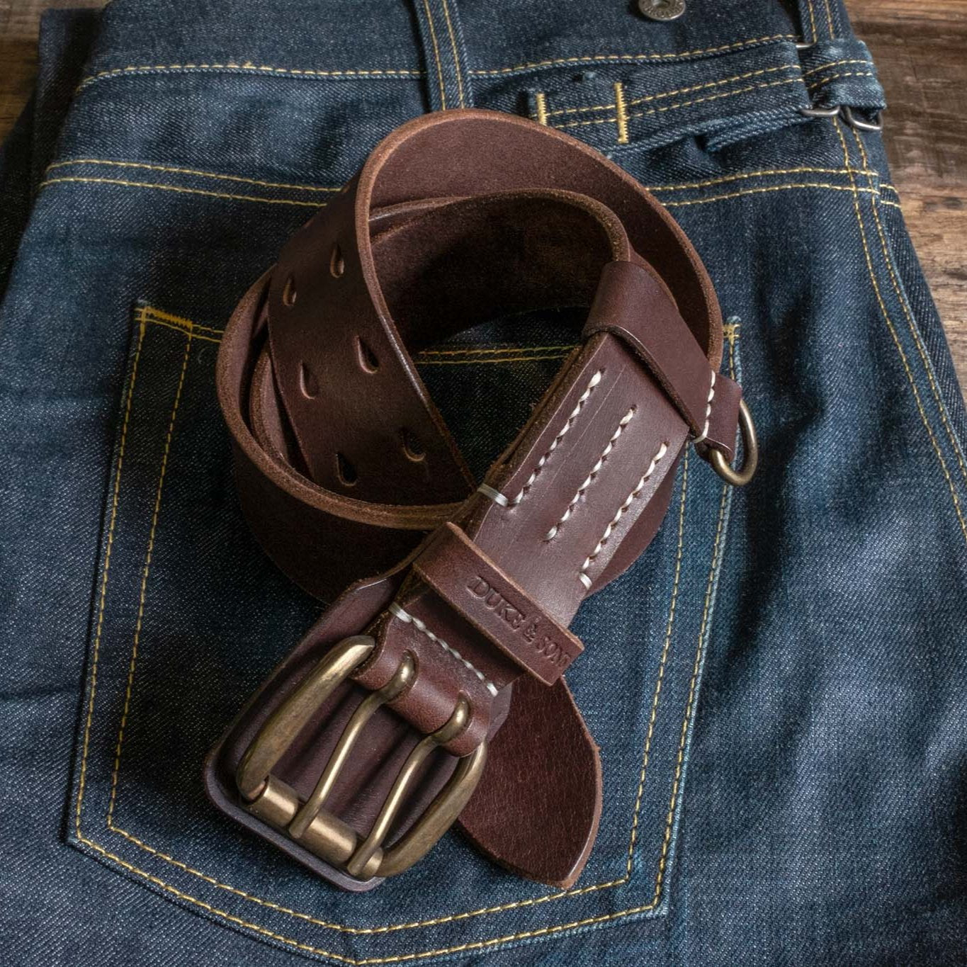 Heavy Duty leather belt in dark brown with extra belt loop, on a jeans. Duke & Sons Leather