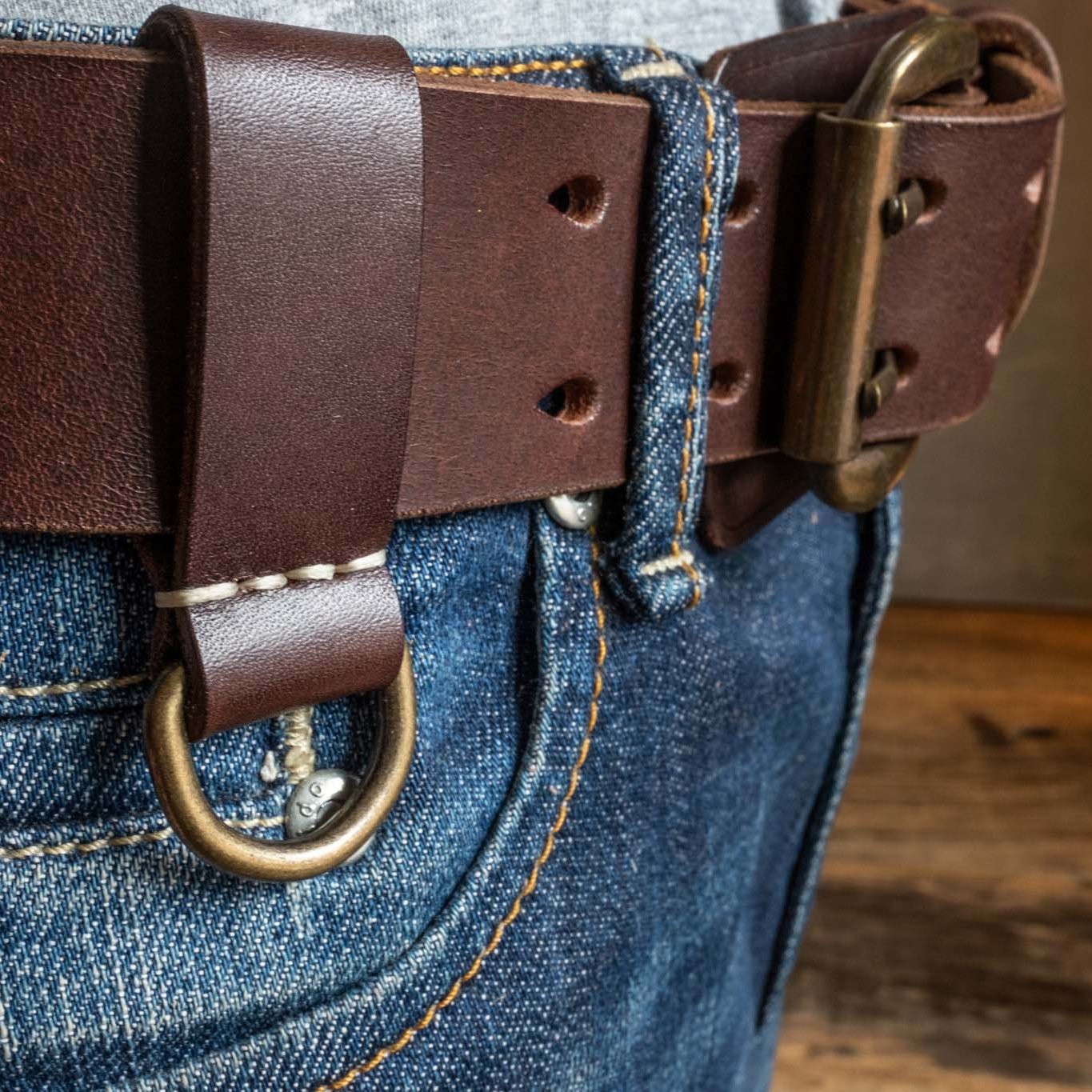 Heavy Duty leather belt in dark brown with extra belt loop, wearing on a jeans. Duke & Sons Leather