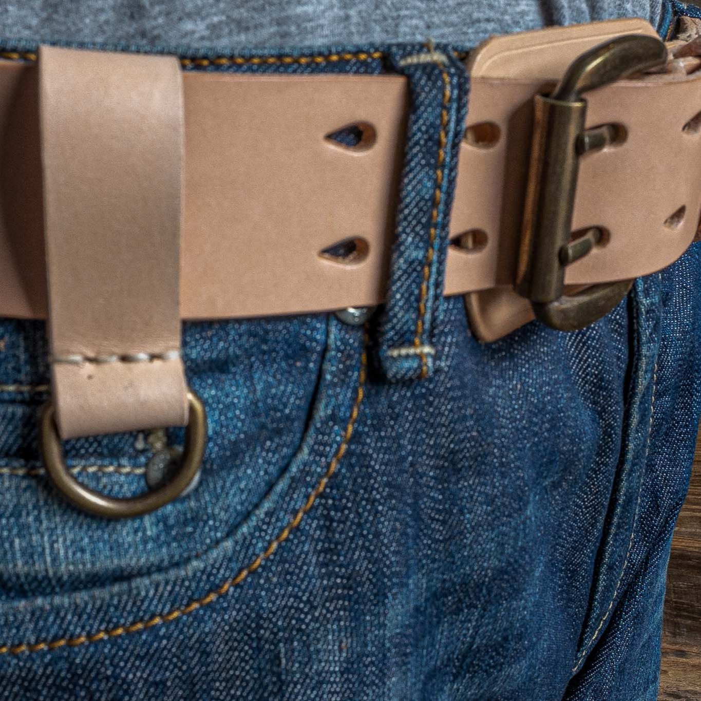 Heavy Duty, natural leather belt with extra belt loop, wearing on a jeans. Duke & Sons Leather