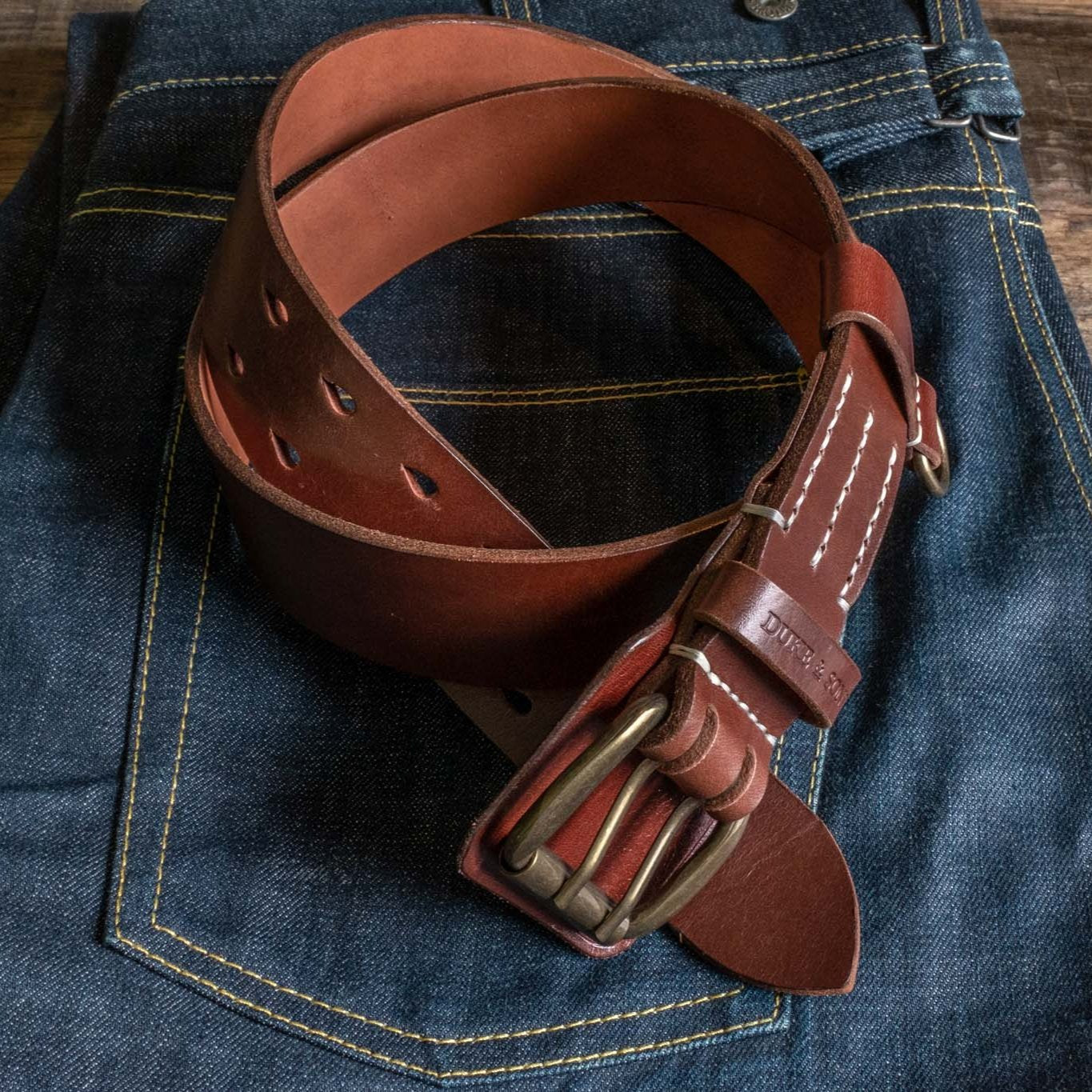 Heavy Duty leather belt in red brown with extra belt loop, on a jeans. Duke & Sons Leather