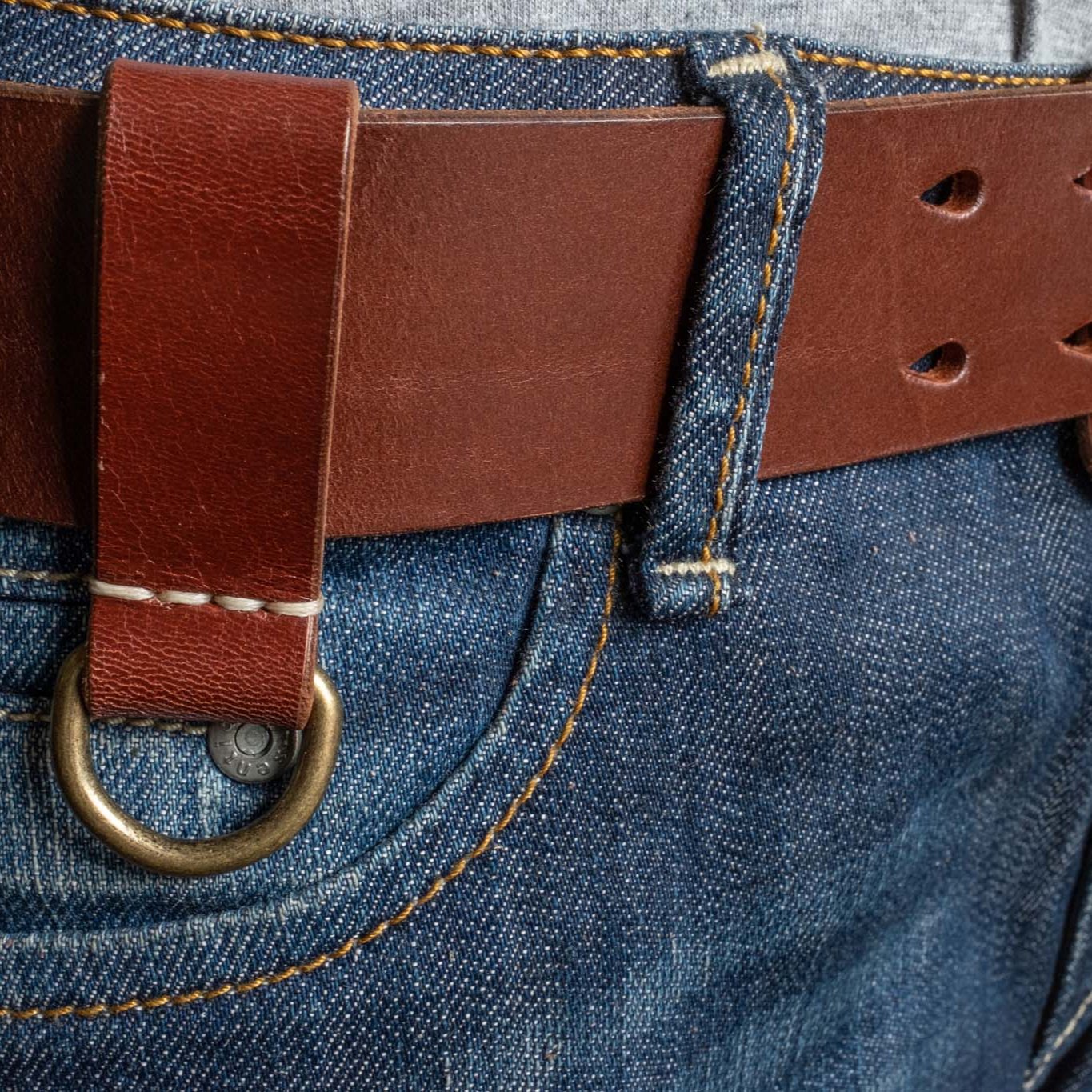 Heavy Duty leather belt in red brown with extra belt loop, wearing on a jeans. Duke & Sons Leather