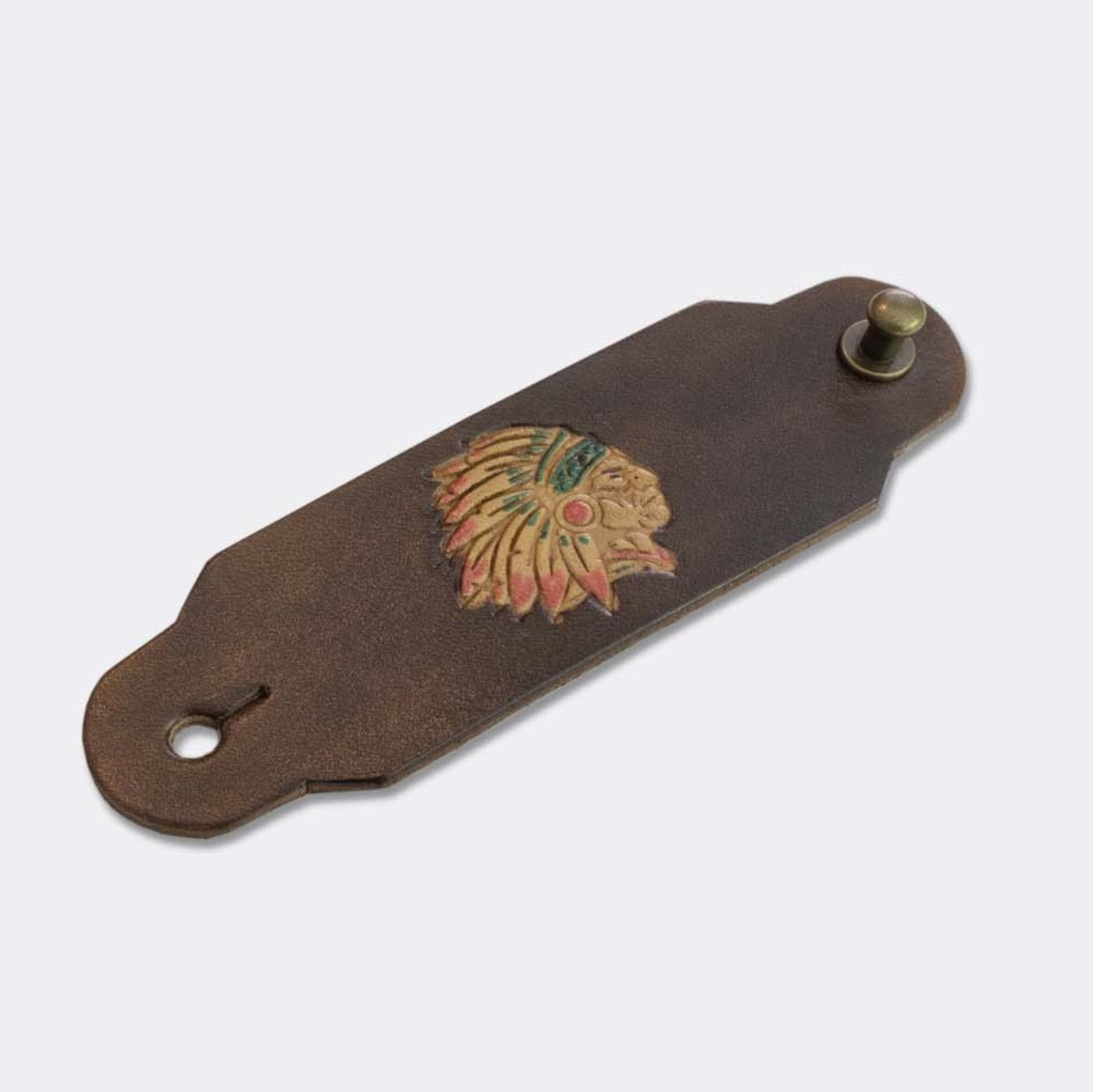 Woggle, bandana / neckerchief slide made from brown leather with an Indian Chief image stamp, slanted view