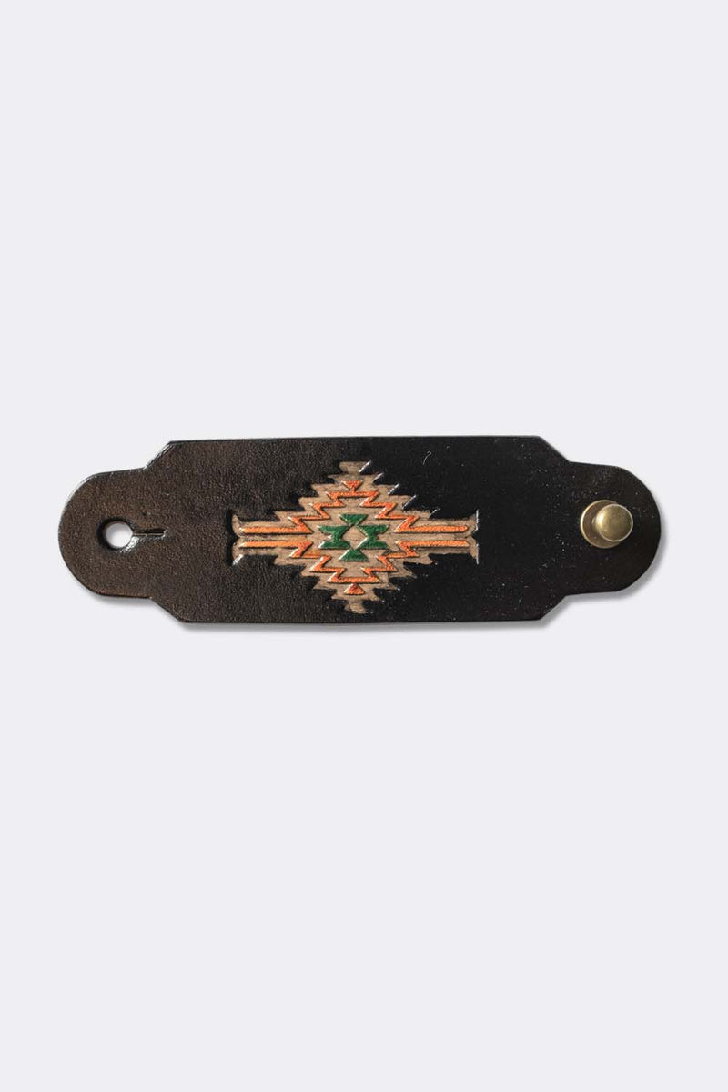 Woggle, bandana / neckerchief slide in black leather with a rectangle native pattern stamp