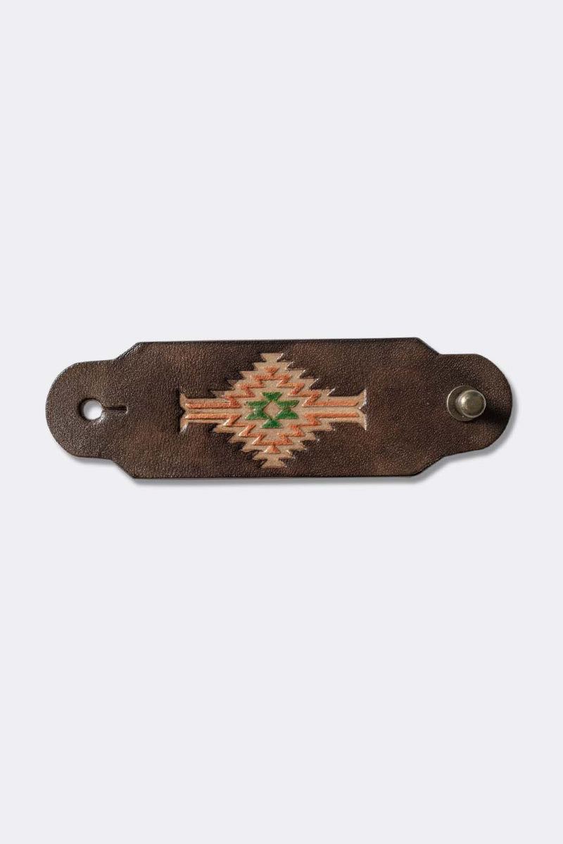 Woggle, bandana / neckerchief slide in brown leather with a rectangle native pattern stamp