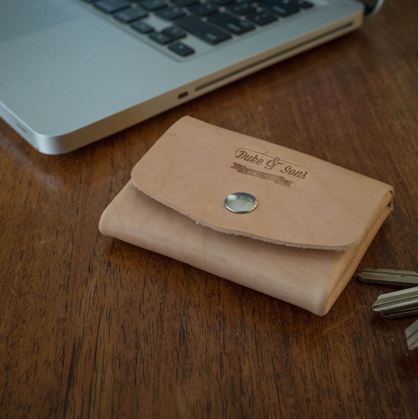 Pocket wallet, (natural vegetan leather) close table scene